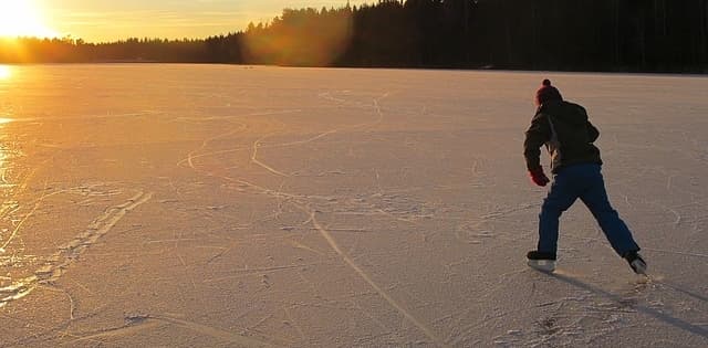 ice skating on frozen pond