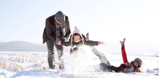 family out side in the snow