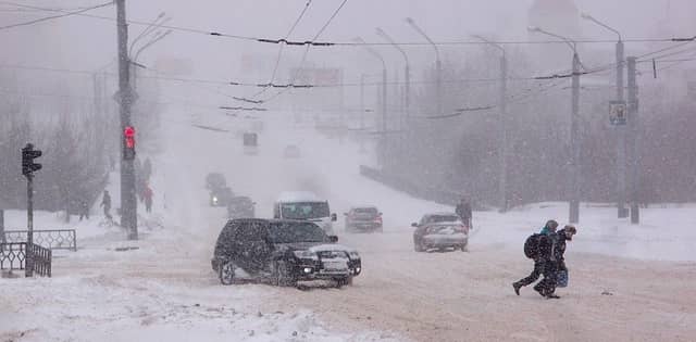 a winter storm in a city street