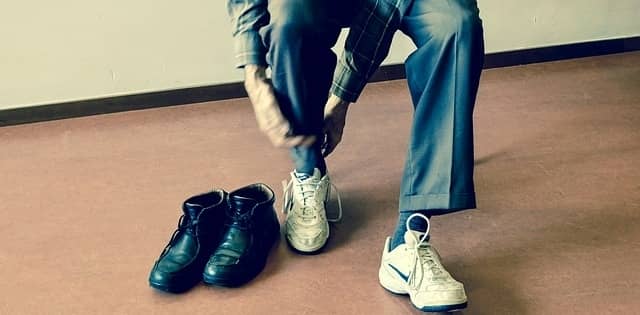 Man changing his shoes