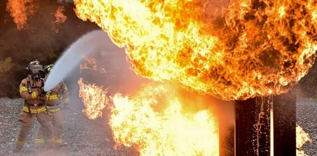 Fire Fighters spraying water on a fire