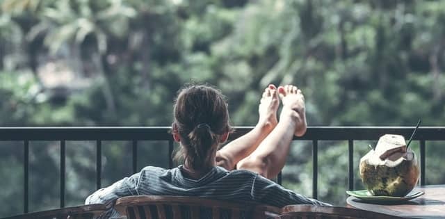 Woman sitting in chair outside